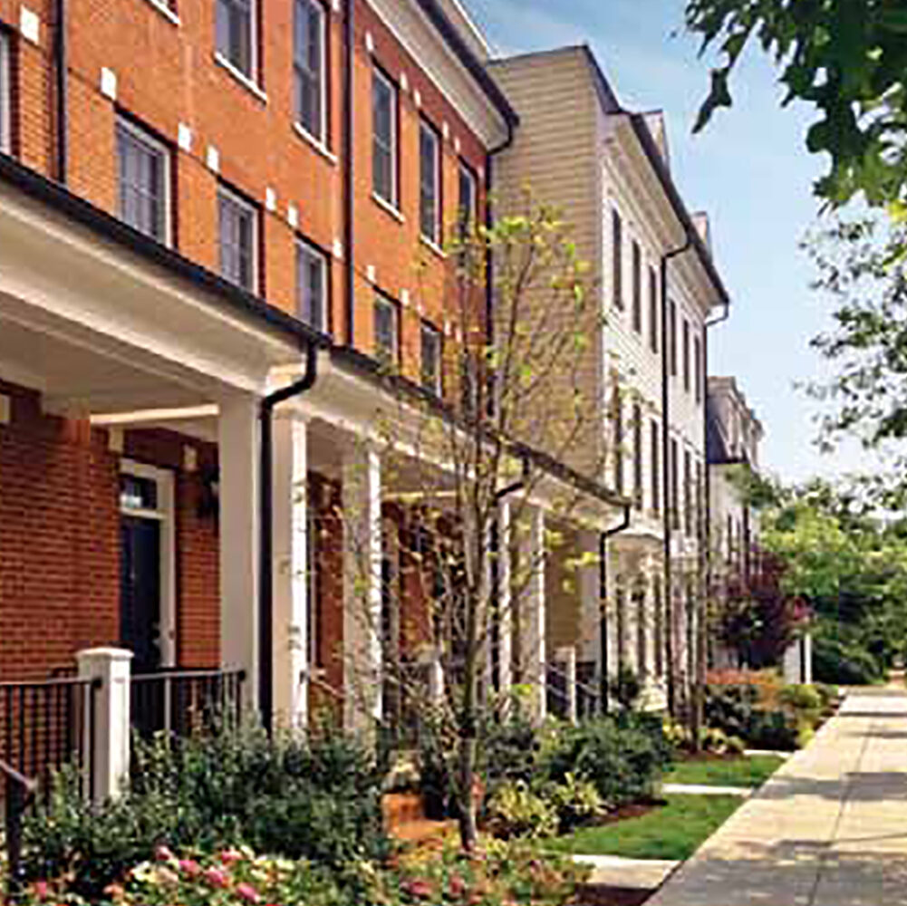 The exterior design of a brick Alexandria, VA condominium building called the Old Town Commons.