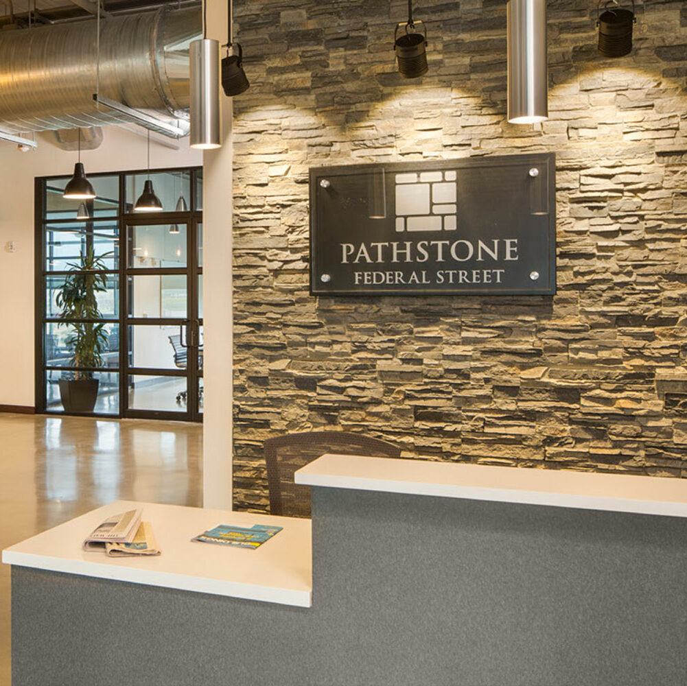 The interior office design at the front desk of Pathstone Federal Street in Englewood, New Jersey.